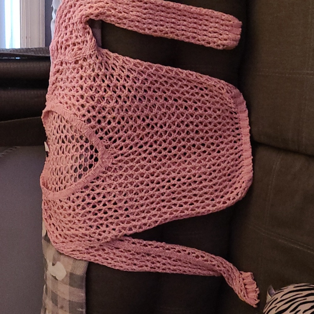 A pink neck,V-neck net long sleave by Solution. Very versatile. In great shape